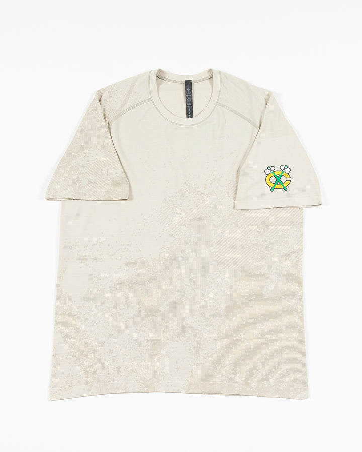 off white lululemon short sleeve t-shirt with Chicago Blackhawks secondary logo on left shoulder - front lay flat