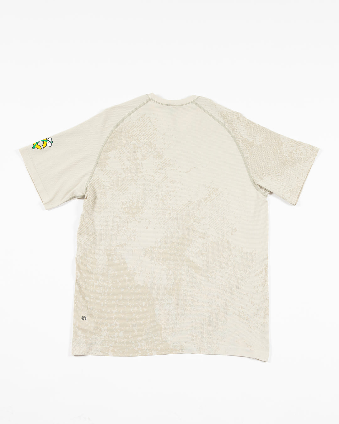 off white lululemon short sleeve t-shirt with Chicago Blackhawks secondary logo on left shoulder - back lay flat
