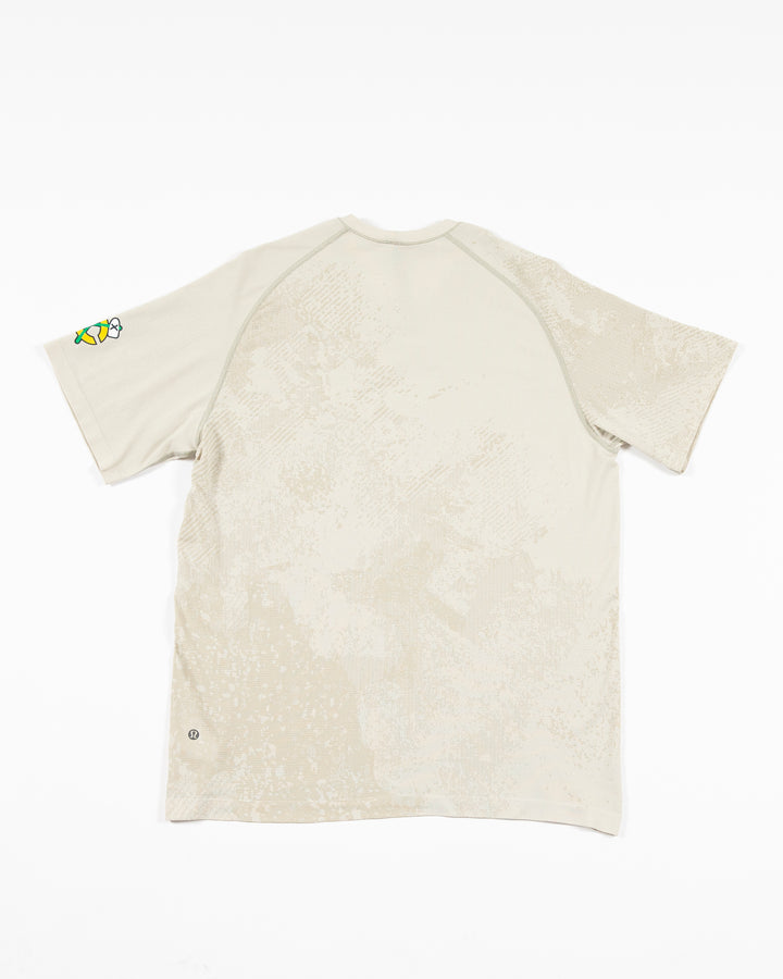 off white lululemon short sleeve t-shirt with Chicago Blackhawks secondary logo on left shoulder - back lay flat