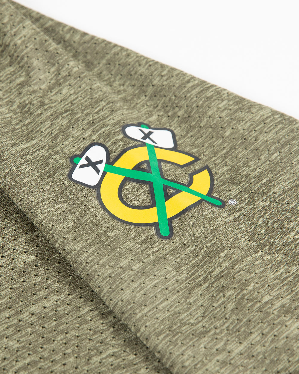 green lululemon half zip jacket with Chicago Blackhawks secondary logo on left shoulder - detail lay flat