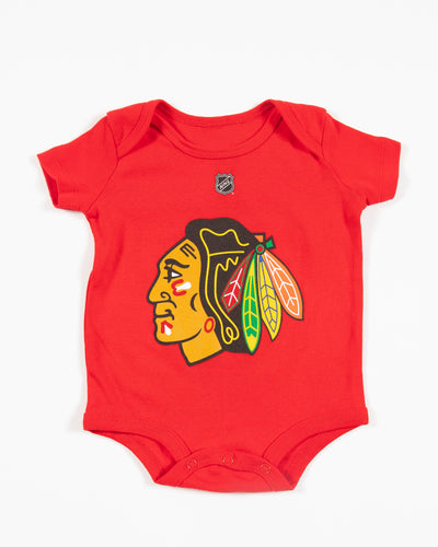 Red Outerstuff newborn onesie with Chicago Blackhawks primary logo across front chest - front lay flat