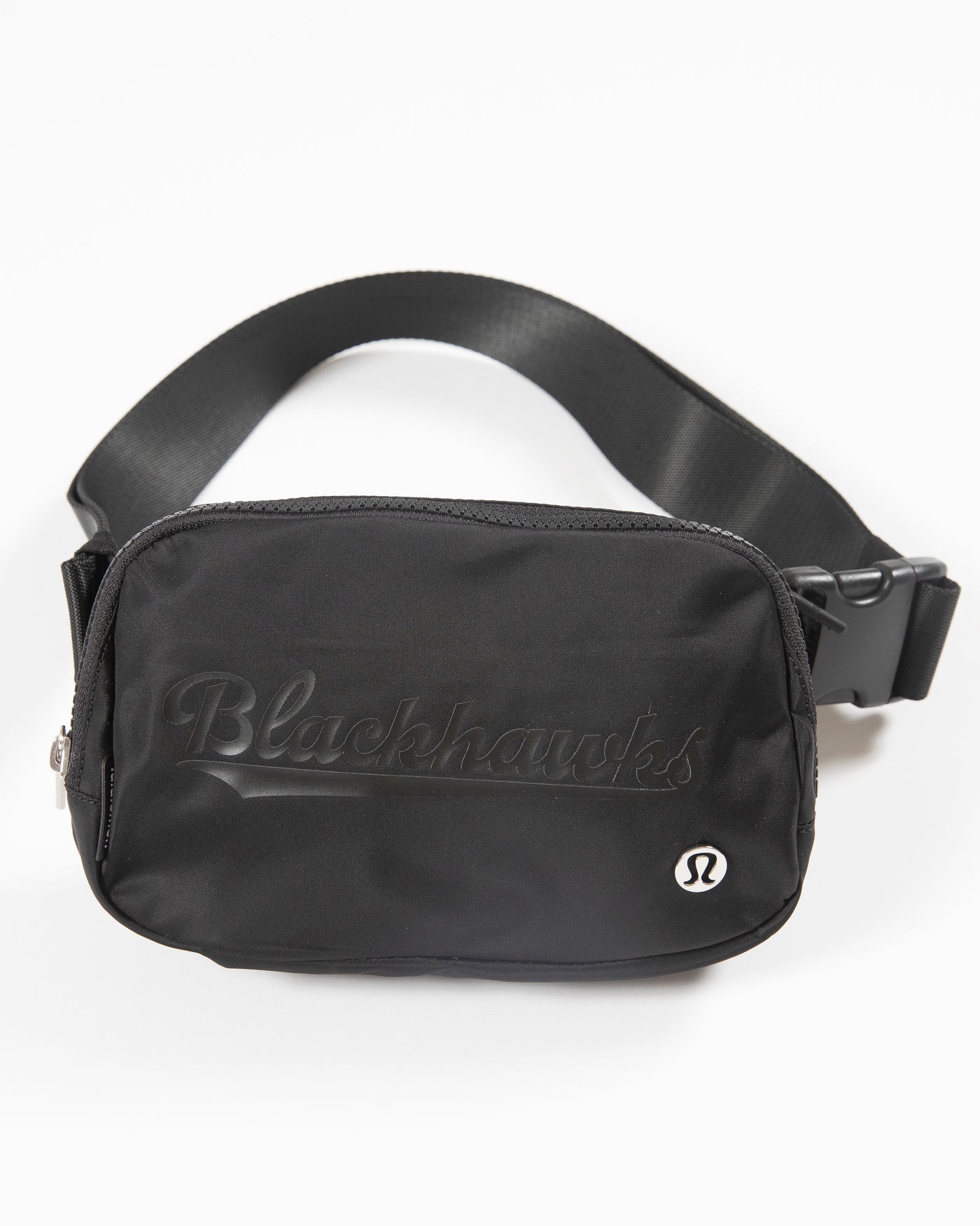 black lululemon Everywhere Belt Bag with Chicago Blackhawks wordmark graphic in black across front - front lay flat