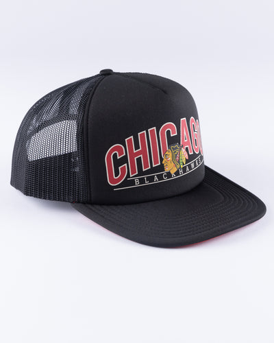 black '47 brand trucker with Chicago Blackhawks wordmark and primary logo across front panel - right angle lay flat
