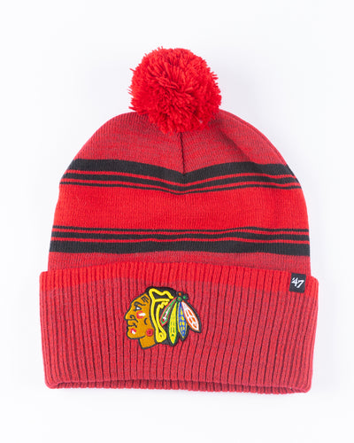 red and black '47 brand knit beanie with red pom and Chicago Blackhawks primary logo embroidered on front cuff - front lay flat
