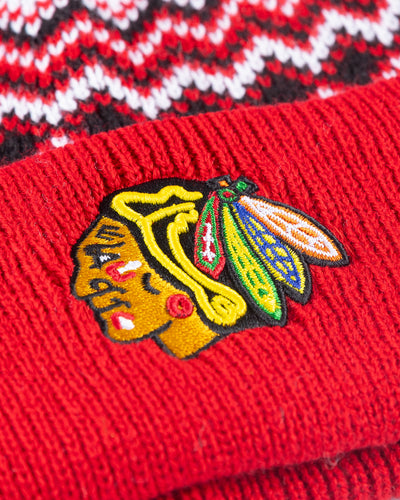 red patterned '47 brand knit beanie with white pom and embroidered Chicago Blackhawks primary logo across cuff - detail lay flat