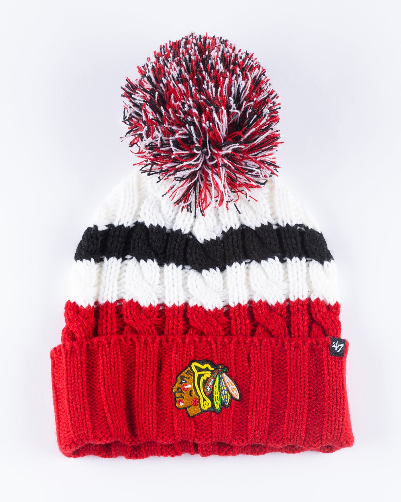 women's '47 brand red, white and black knit beanie with multi color pom and Chicago Blackhawks primary logo embroidered on front cuff - front  lay flat