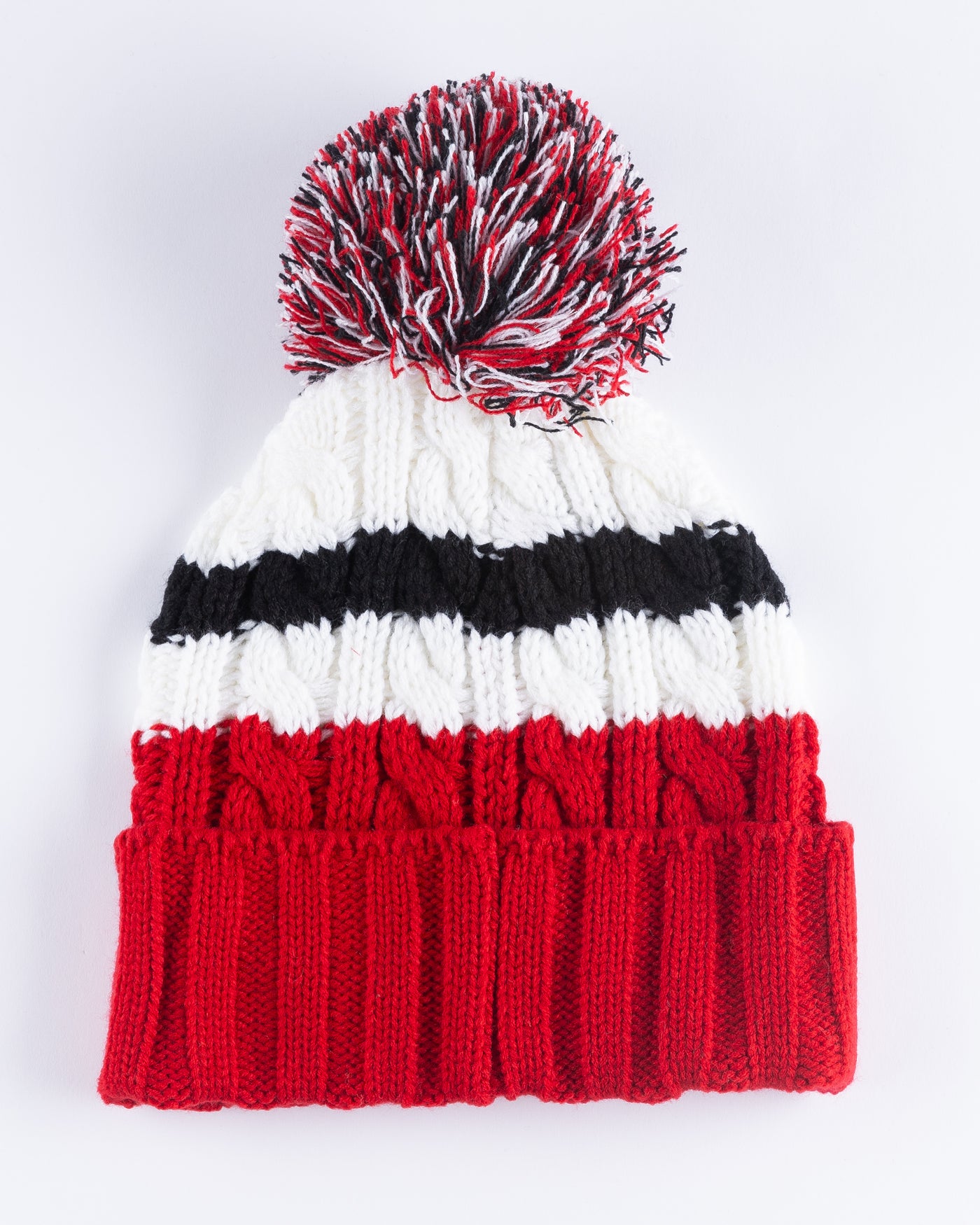 women's '47 brand red, white and black knit beanie with multi color pom and Chicago Blackhawks primary logo embroidered on front cuff - back lay flat