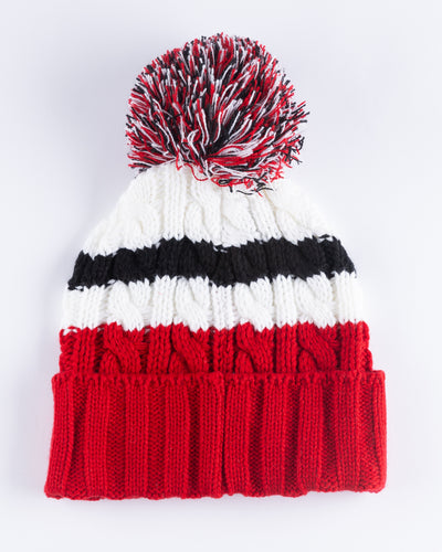 women's '47 brand red, white and black knit beanie with multi color pom and Chicago Blackhawks primary logo embroidered on front cuff - back lay flat