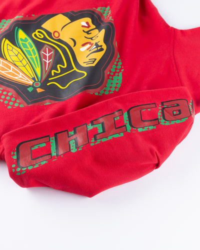 red women's Mitchell & Ness crop hoodie with Chicago Blackhawks primary logo across front and Chicago wordmark on hood - detail front and hood lay flat