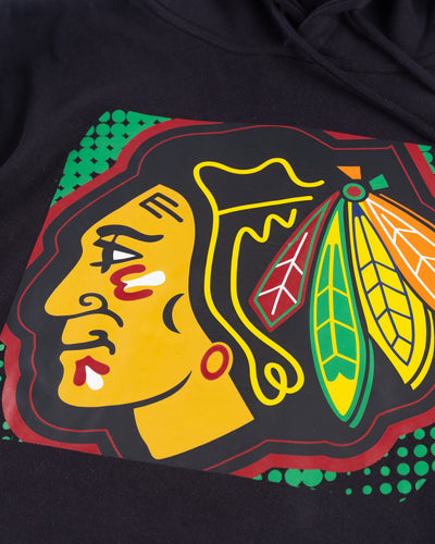 black Mitchell & Ness hoodie with Chicago Blackhawks primary logo across front and Chicago wordmark on left arm - detail front lay flat