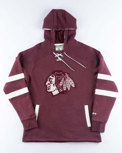 burgundy CCM lace up hoodie with hockey jersey inspired design and Chicago Blackhawks primary logo across front chest - front lay flat