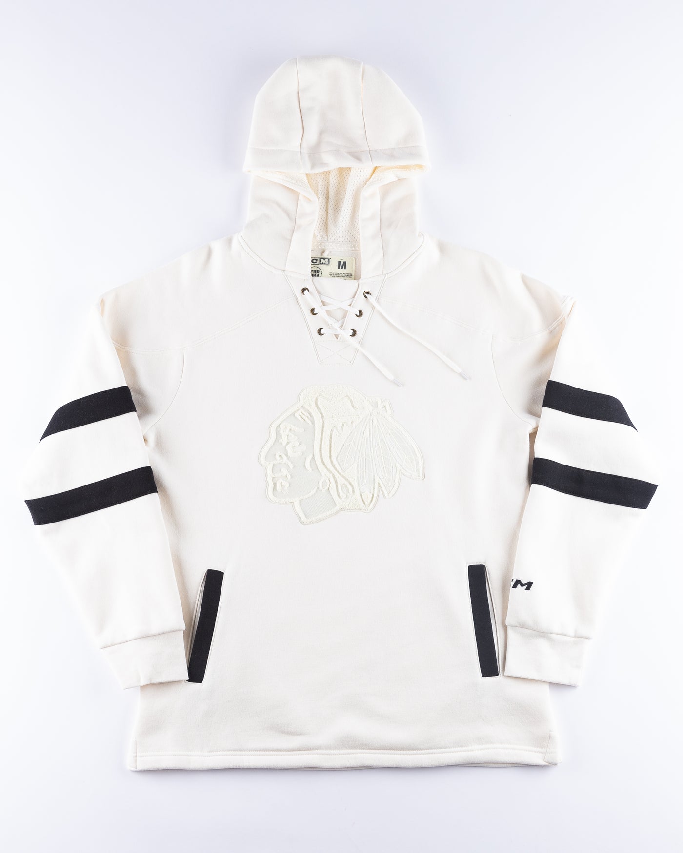 white CCM lace up hoodie with hockey jersey inspired design and Chicago Blackhawks primary logo across front chest - front lay flat