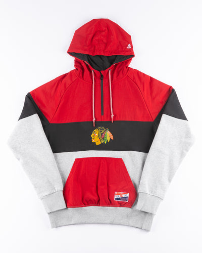 red, grey and black New Era 1/4 Zip Hoodie with Chicago Blackhawks primary logo embroidered on front and wordmark printed on back - front lay flat