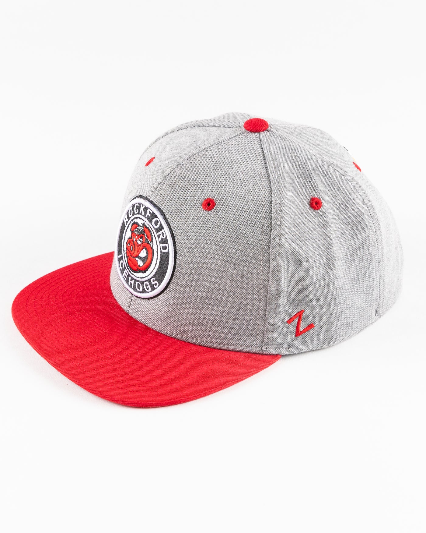 grey Rockford IceHogs snapback with red brim and embroidered IceHogs patch - left angle lay flat