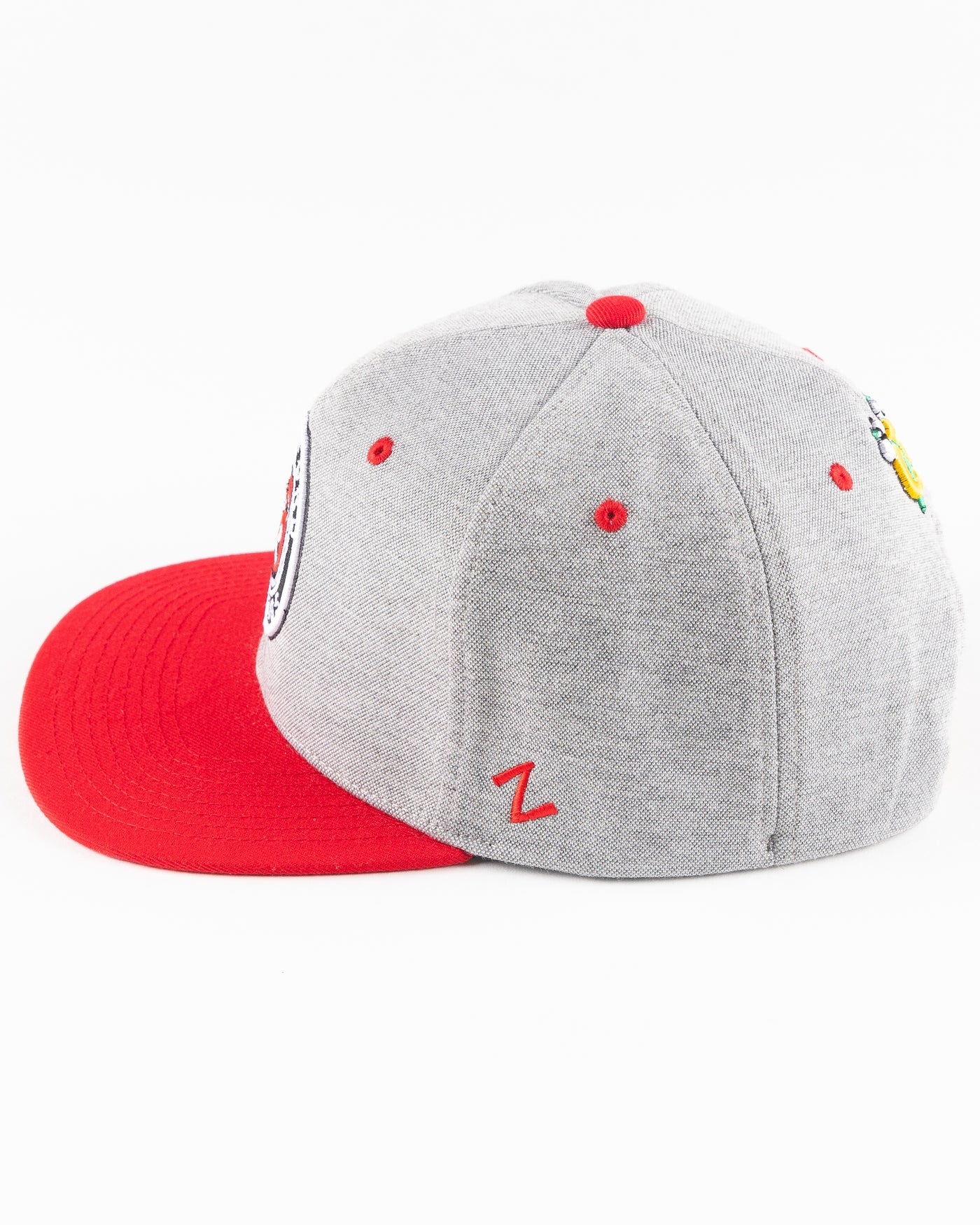 grey Rockford IceHogs snapback with red brim and embroidered IceHogs patch - left side lay flat