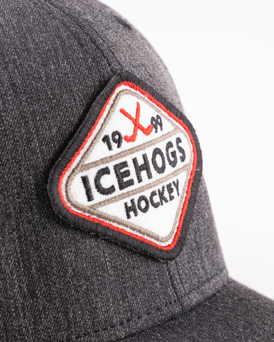 faded black and white trucker with Rockford IceHogs patch embroidered on front - detail lay flat