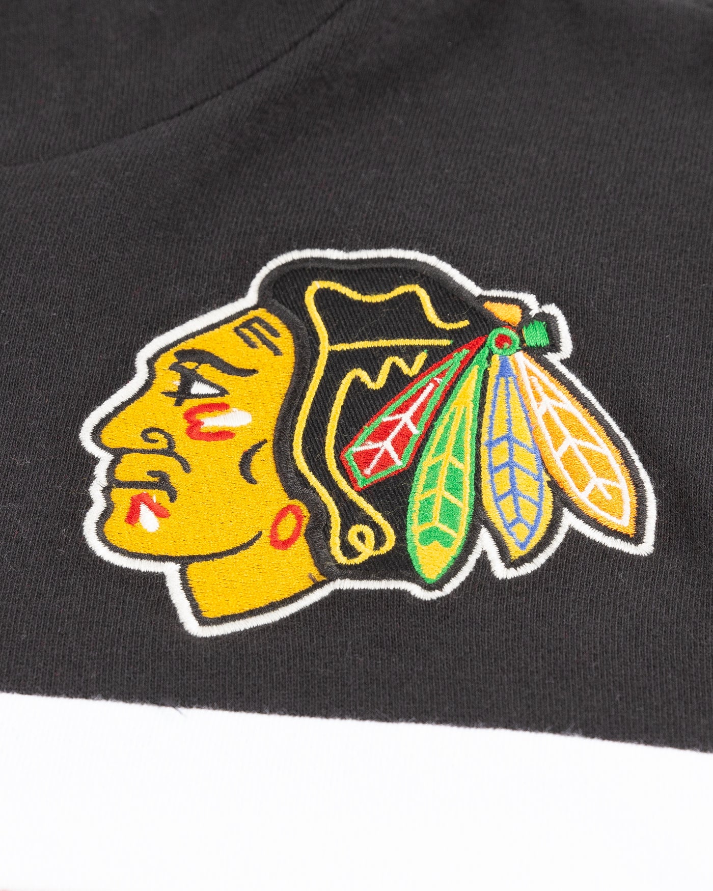 black white and red '47 brand hoodie with Chicago Blackhawks primary logo on left chest - detail lay flat
