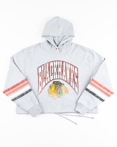 grey '47 brand cropped women's hoodie with Chicago Blackhawks distressed graphic on front - front lay flat