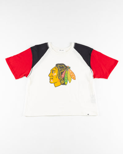 white 47 brand ladies tee with colorblocked black and red sleeves with Chicago Blackhawks primary logo across front - front lay flat