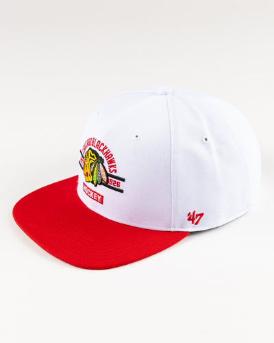 white and red '47 brand flat brim snapback with Chicago Blackhawks graphic embroidered on front - left angle lay flat 