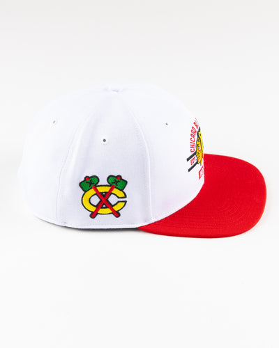 white and red '47 brand flat brim snapback with Chicago Blackhawks graphic embroidered on front - right side lay flat 