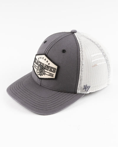 grey and white '47 trucker with Chicago Blackhawks patch embroidered on front - left angle lay flat