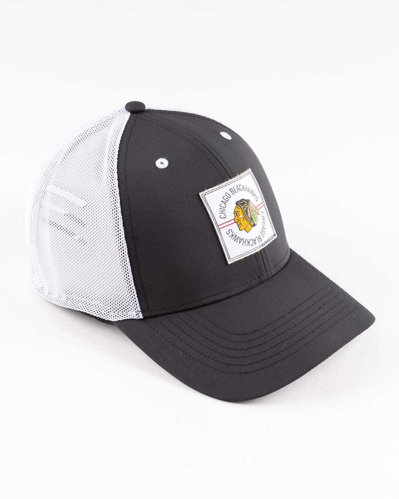 black and white '47 brand trucker cap with Chicago Blackhawks patch embroidered on front - right angle lay flat