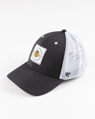 black and white '47 brand trucker cap with Chicago Blackhawks patch embroidered on front - left angle lay flat