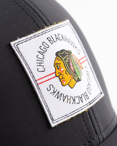 black and white '47 brand trucker cap with Chicago Blackhawks patch embroidered on front - detail lay flat