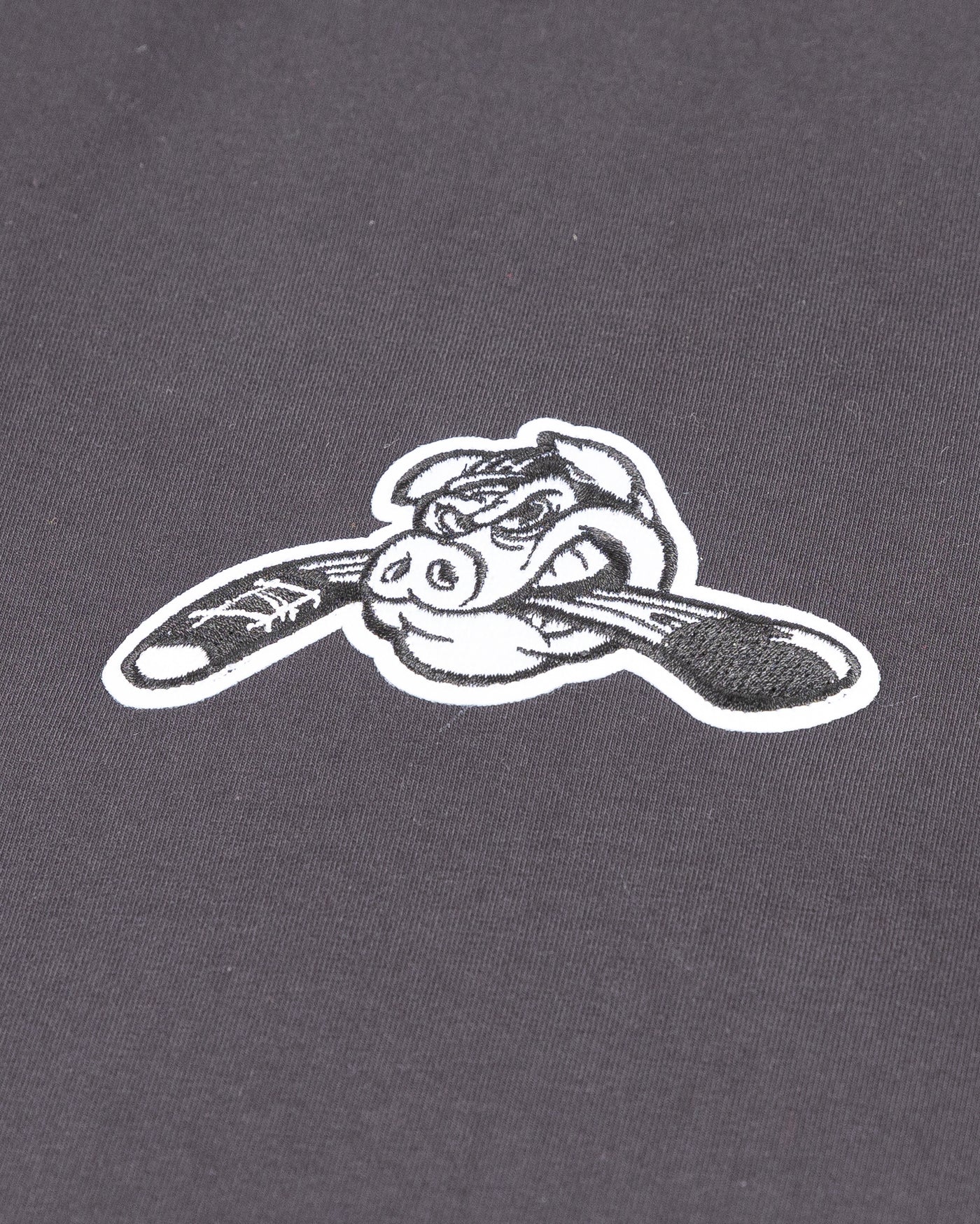 black CCM short sleeve tee with Rockford IceHogs tonal Hammy embroidered on left chest - detail lay flat
