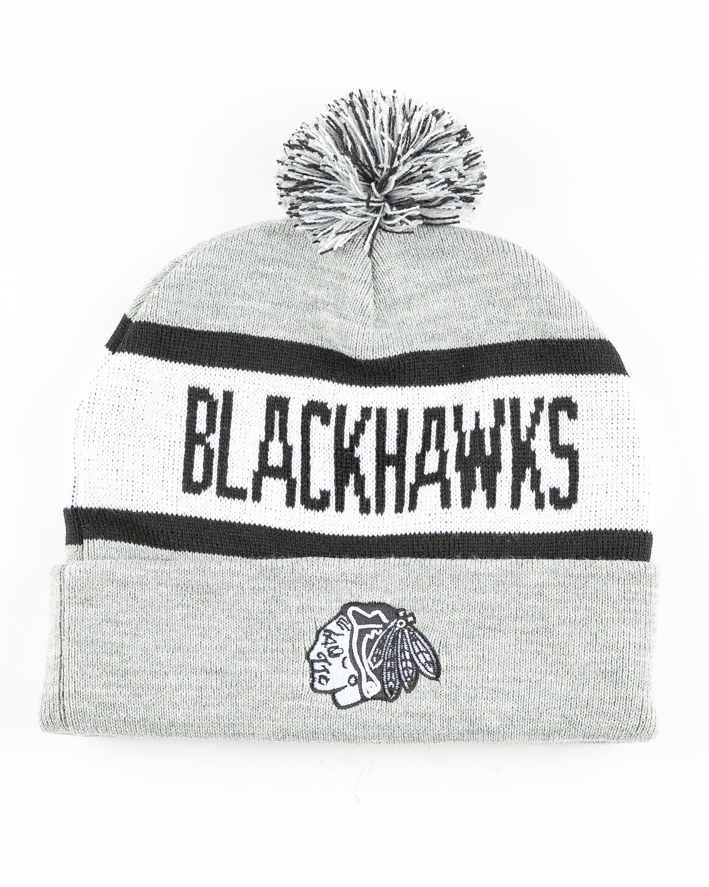 grey black and white knit beanie with Chicago Blackhawks primary logo embroidered on front and wordmark across - front lay flat