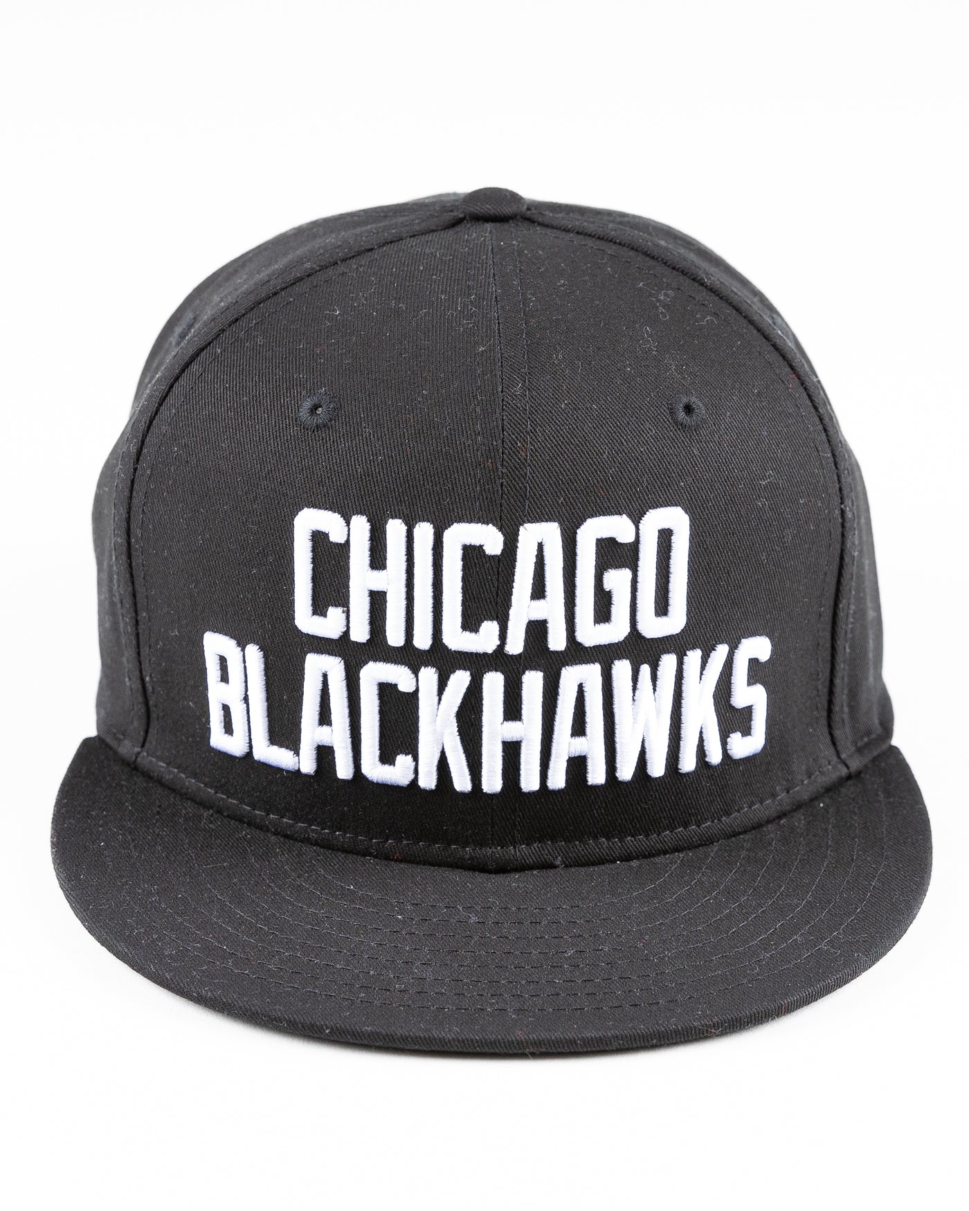 black Starter flat brim snapback with Chicago Blackhawks wordmark embroidered on front - front lay flat
