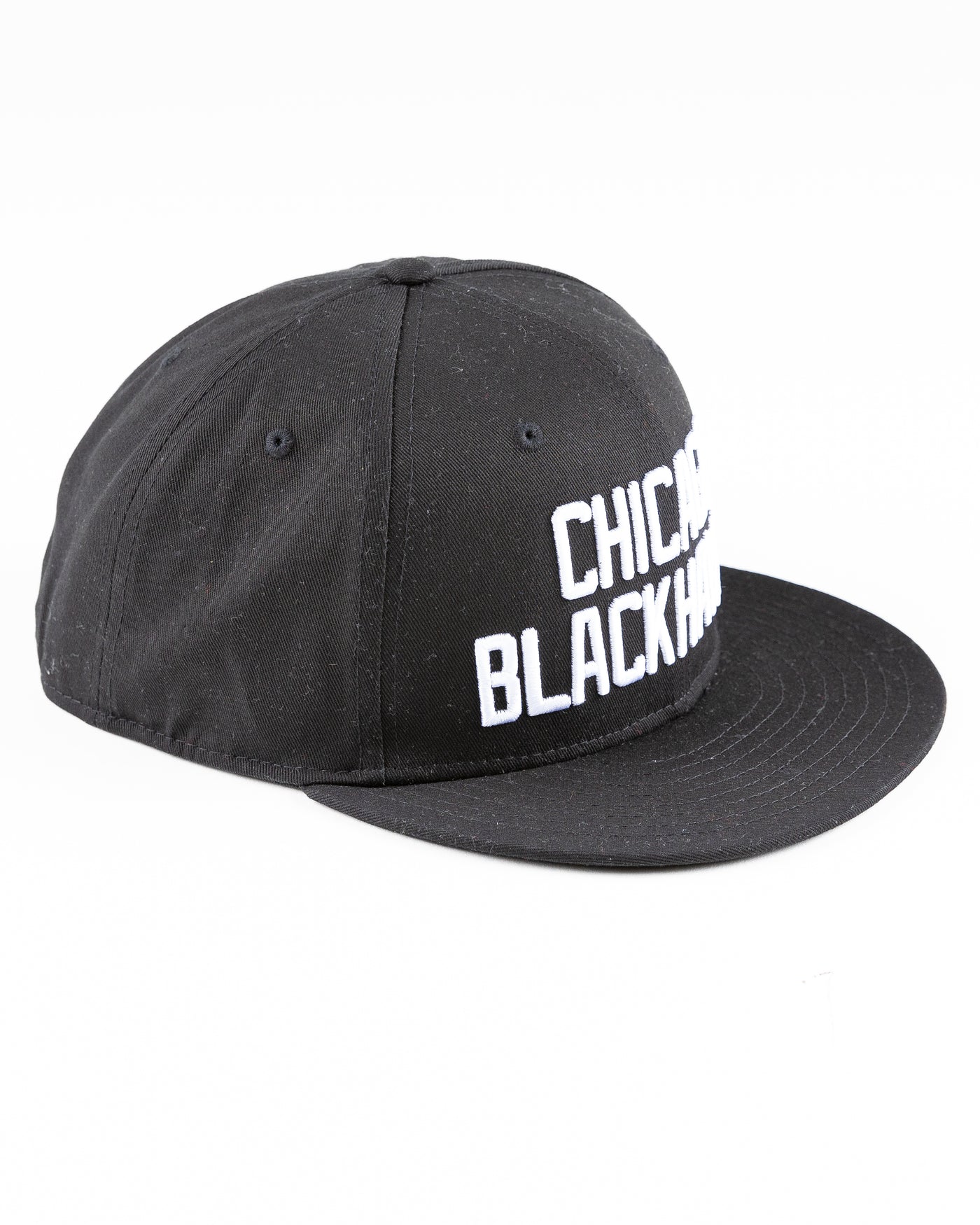 black Starter flat brim snapback with Chicago Blackhawks wordmark embroidered on front - angled right lay flat