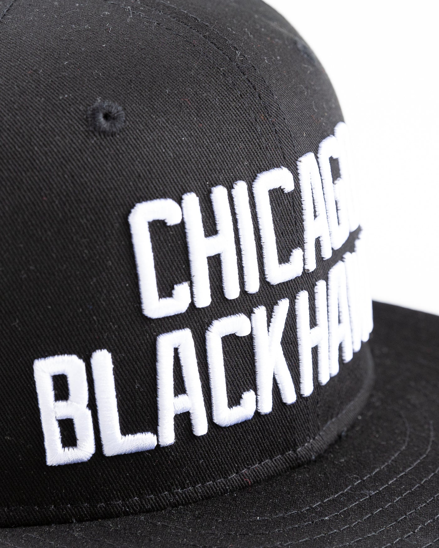 black Starter flat brim snapback with Chicago Blackhawks wordmark embroidered on front - detail lay flat
