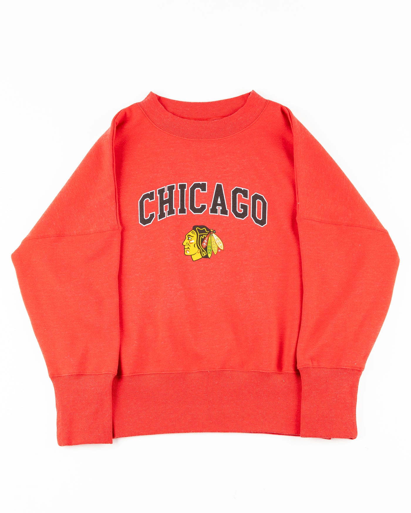 red ladies crewneck with Chicago wordmark and Chicago Blackhawks primary logo across front - front lay flat