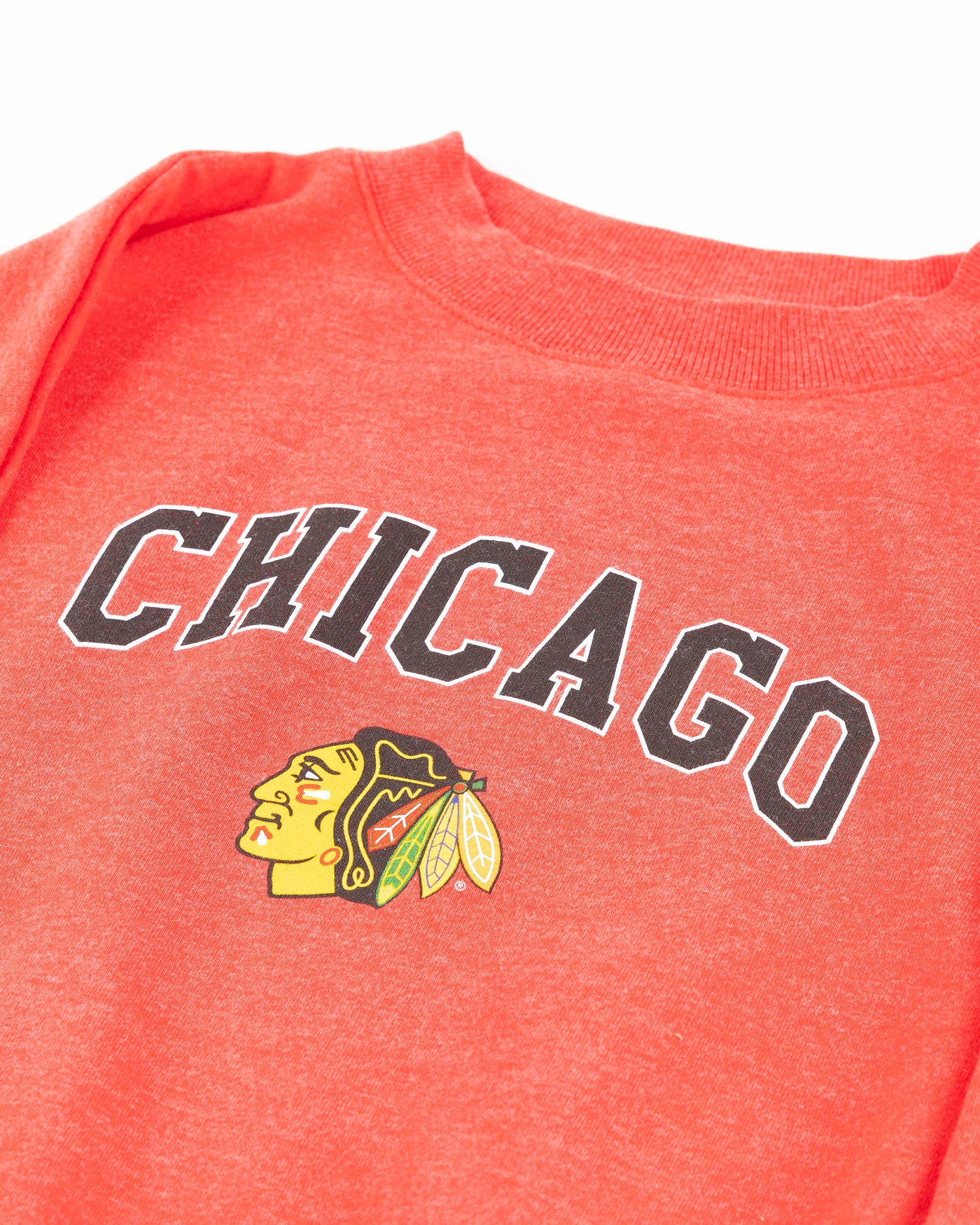 red ladies crewneck with Chicago wordmark and Chicago Blackhawks primary logo across front - detail lay flat