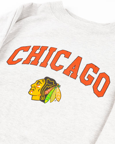 grey chicka-d crewneck with Chicago wordmark and Chicago Blackhawks primary logo across front - detail lay flat