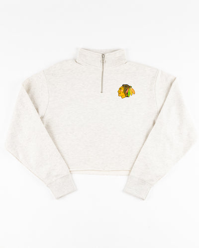 light grey chicka-d cropped quarter zip with Chicago Blackhawks primary logo on left chest - front lay flat