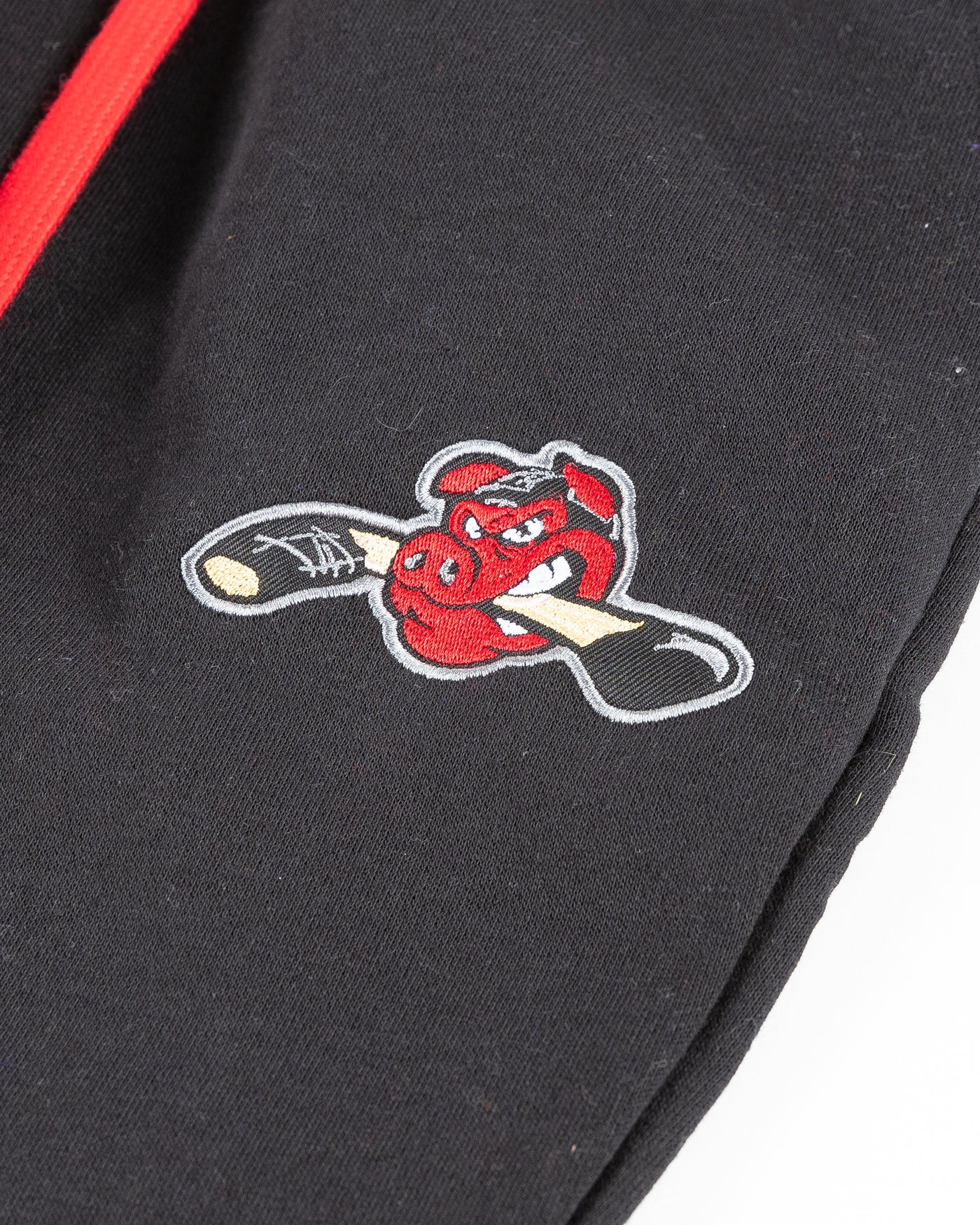 black Rockford IceHogs sweatpants with embroidered Hammy logo on left thigh - detail lay flat