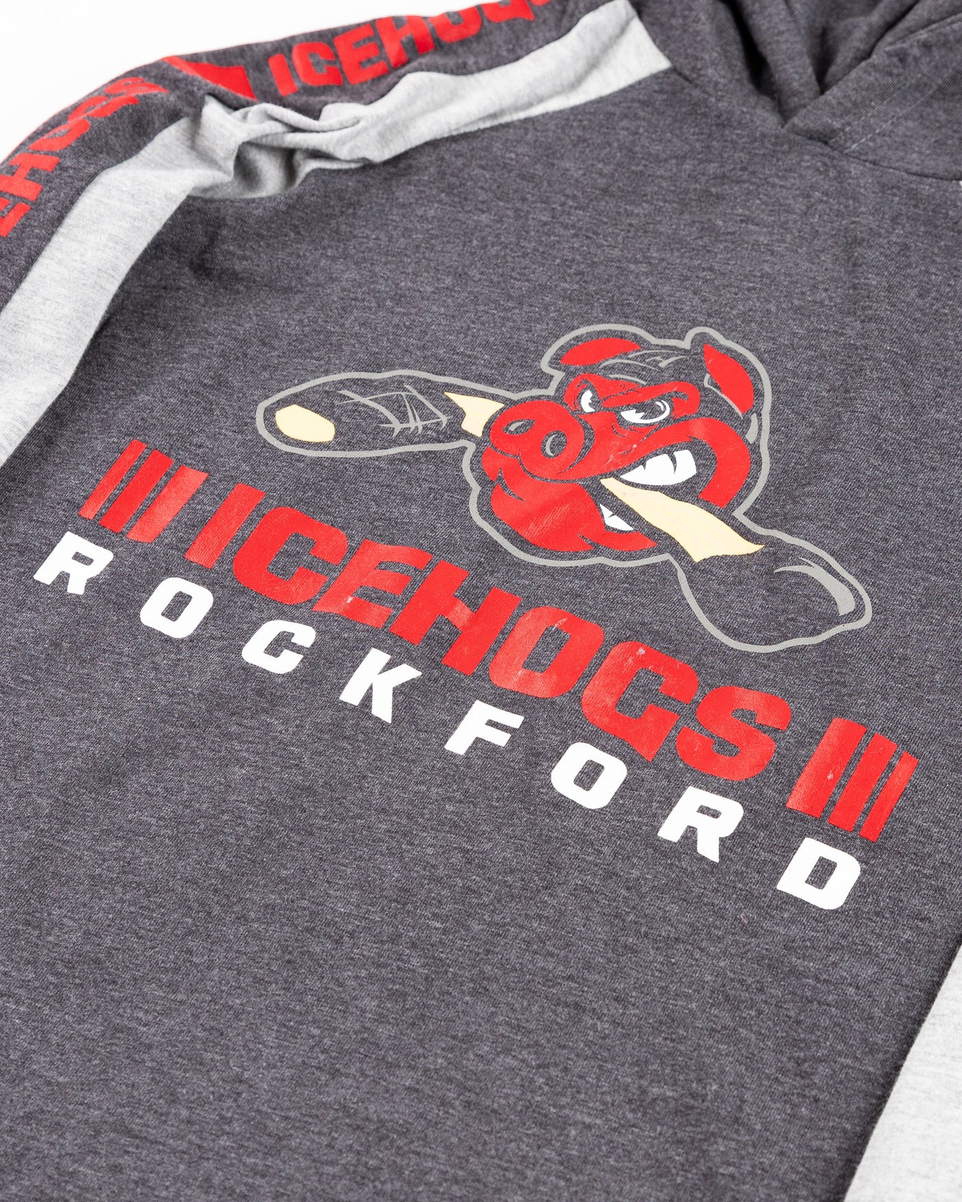 Colosseum two tone youth hoodie with Rockford IceHogs logo across front and wordmark on sleeves - detail lay flat