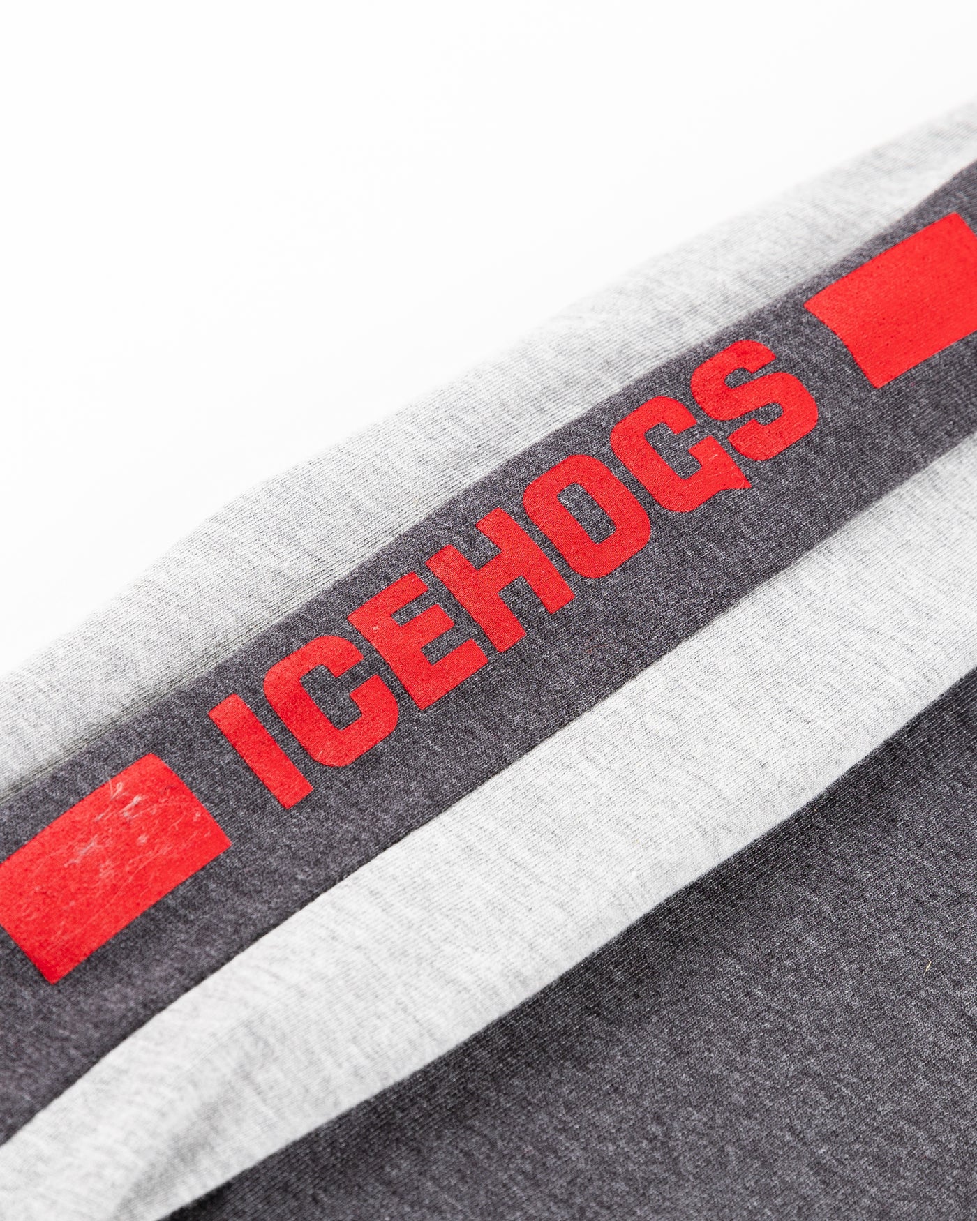 Colosseum two tone youth hoodie with Rockford IceHogs logo across front and wordmark on sleeves - sleeve detail lay flat