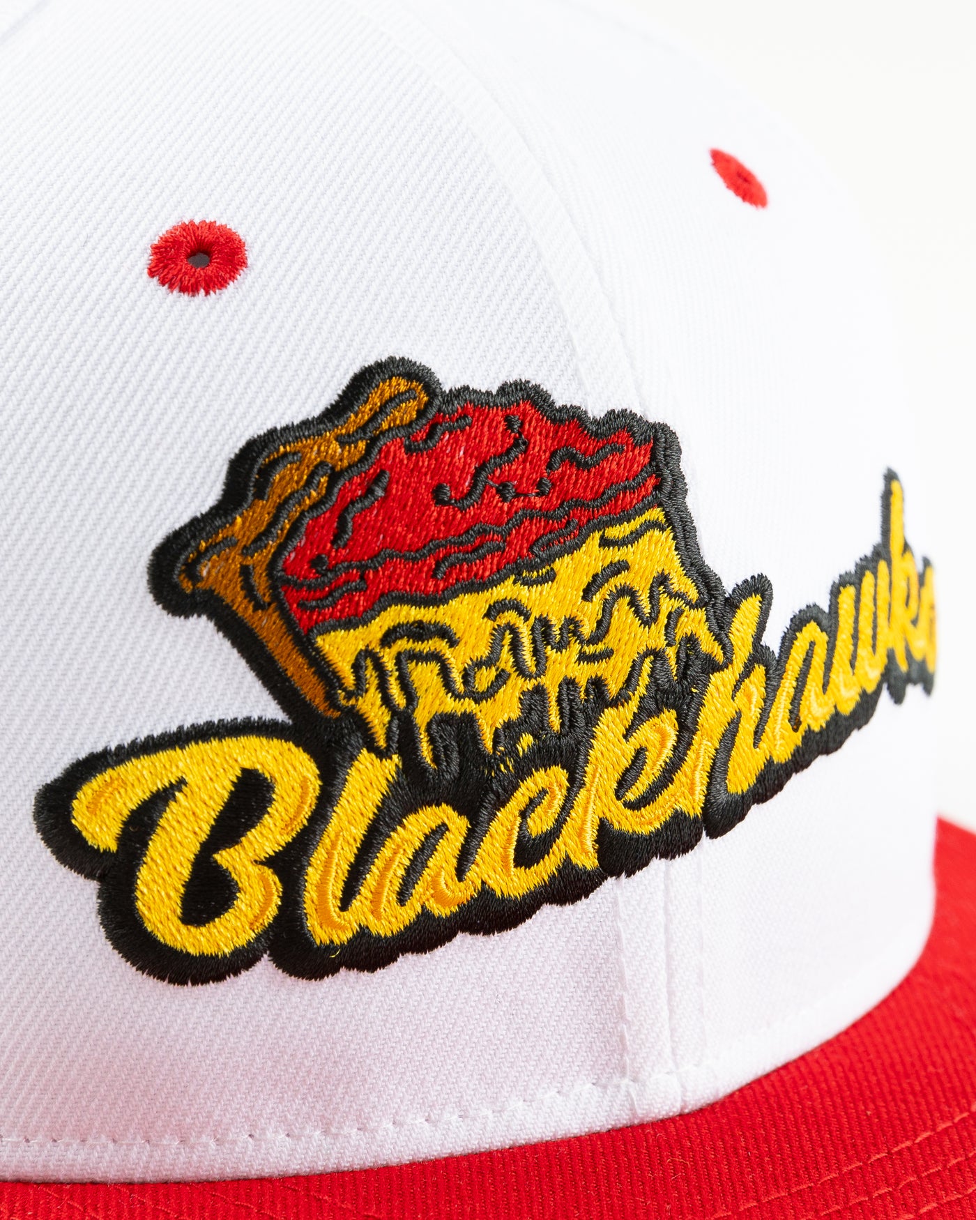 white and red New Era snapback with Chicago Blackhawks wordmark and deep dish pizza design - front detail lay flat