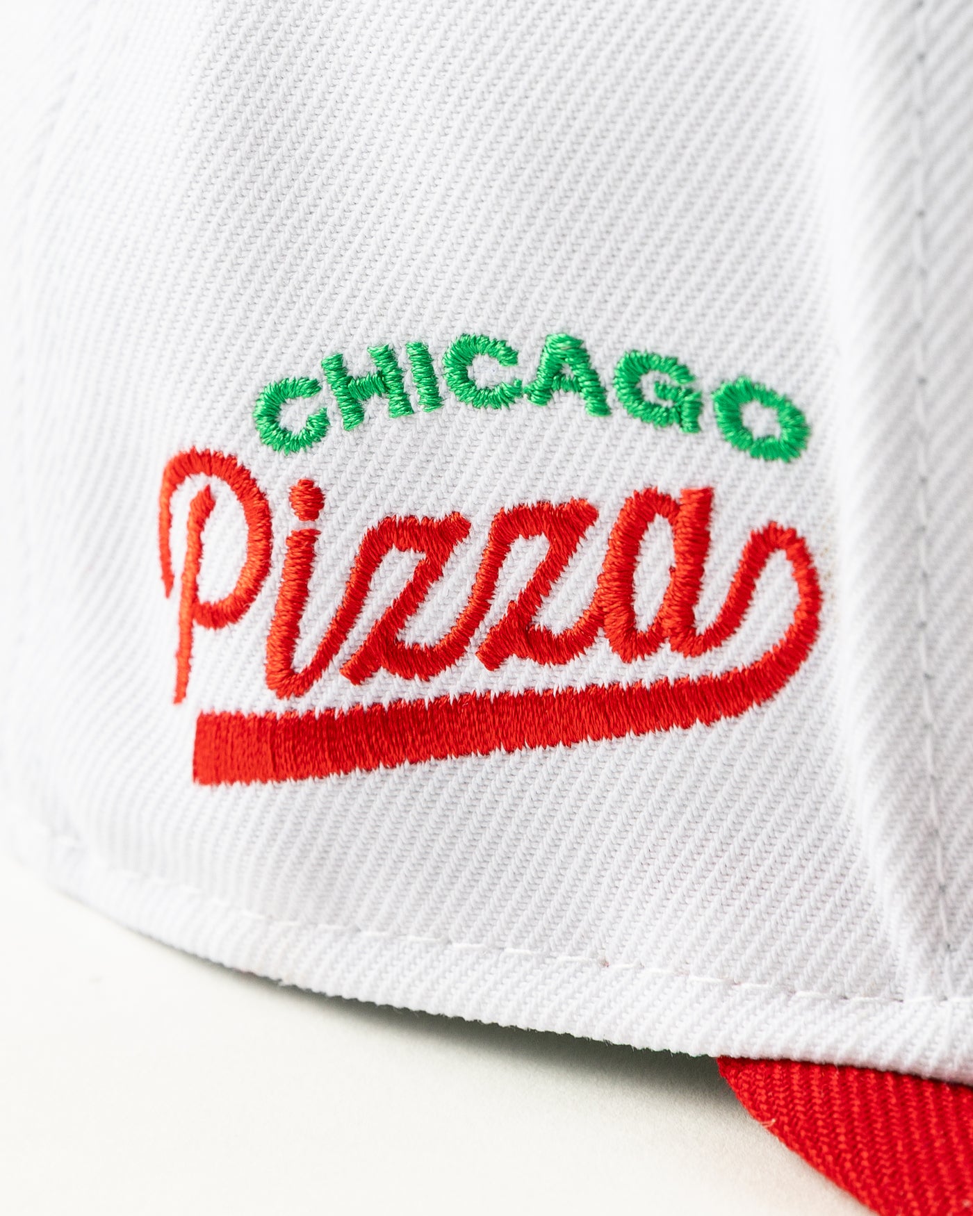 white and red New Era snapback with Chicago Blackhawks wordmark and deep dish pizza design - alt detail lay flat