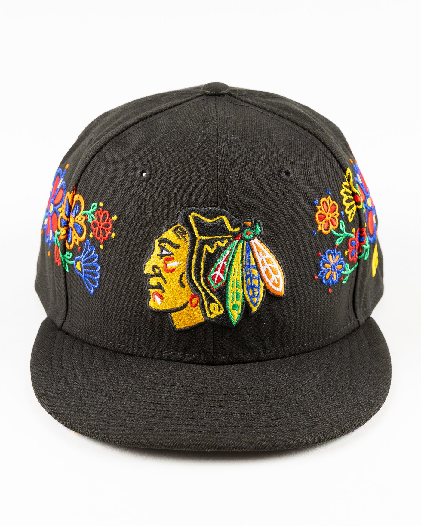 black New Era snapback with Chicago Blackhawks primary logo surrounded by floral pattern - front lay flat