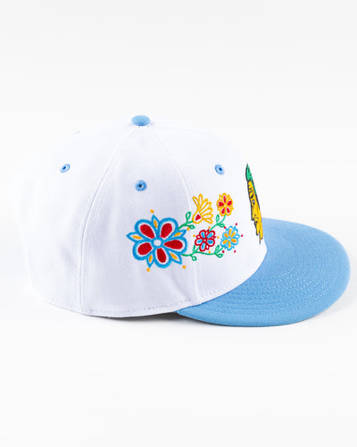 white and blue New Era snapback with vintage Chicago Blackhawks logo and floral pattern on front - right side lay flat
