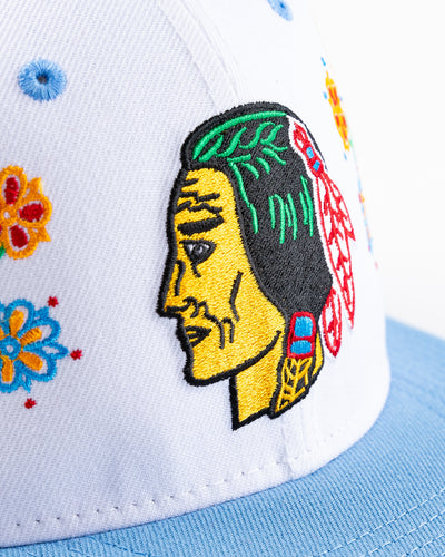 white and blue New Era snapback with vintage Chicago Blackhawks logo and floral pattern on front - detail front lay flat