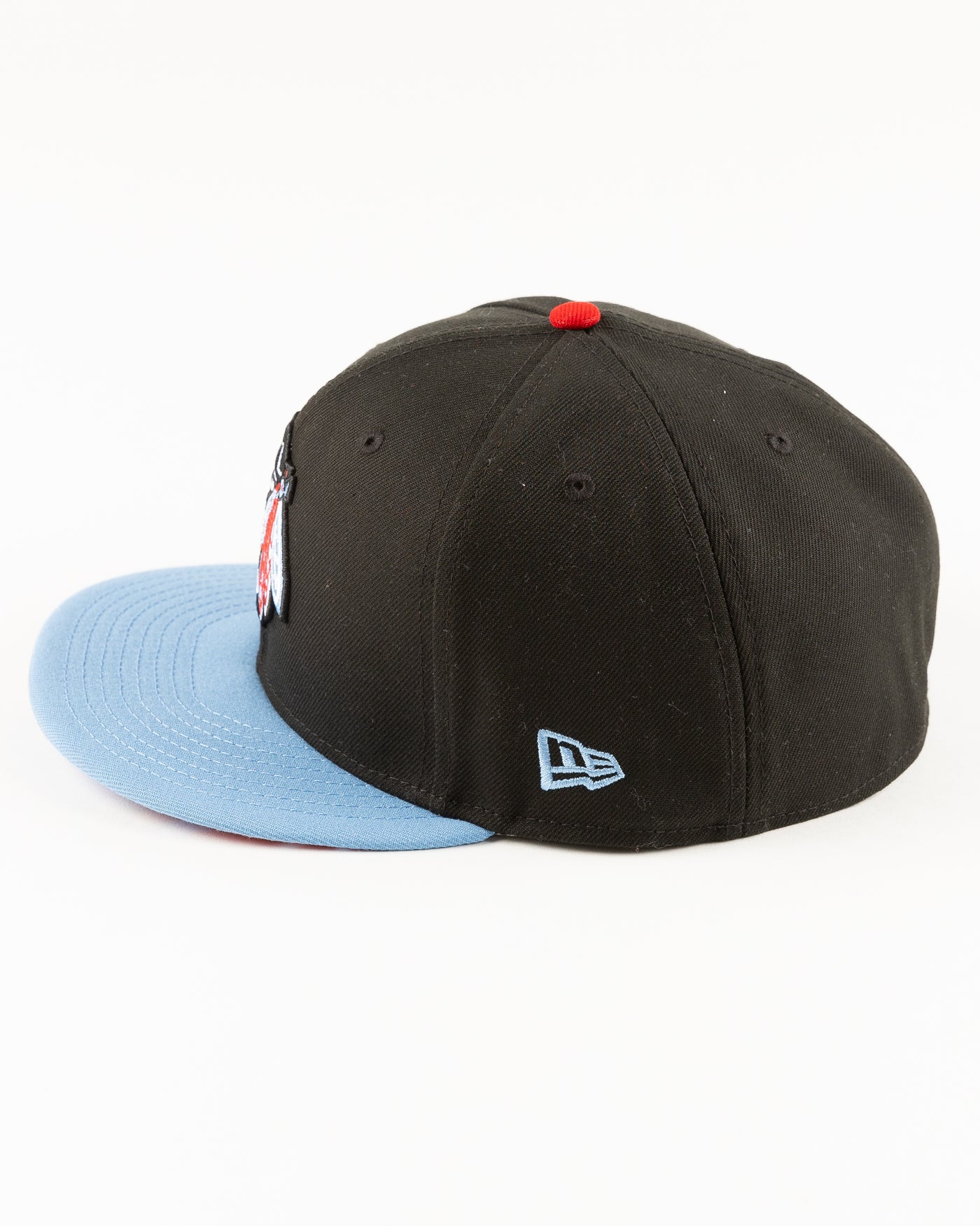 black and blue New Era fitted cap with tonal Chicago Blackhawks primary logo on front - left side lay flat