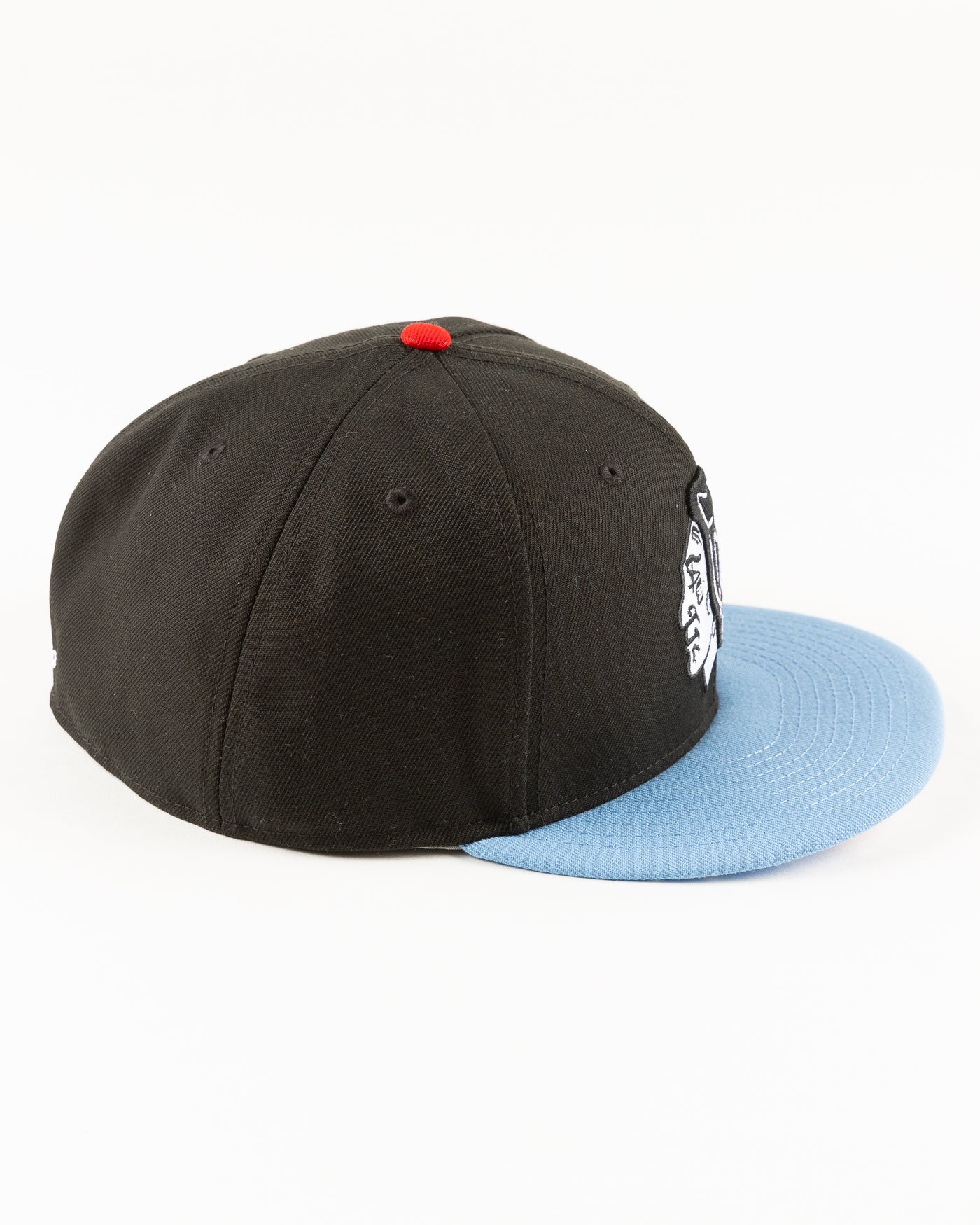 black and blue New Era fitted cap with tonal Chicago Blackhawks primary logo on front - right side lay flat