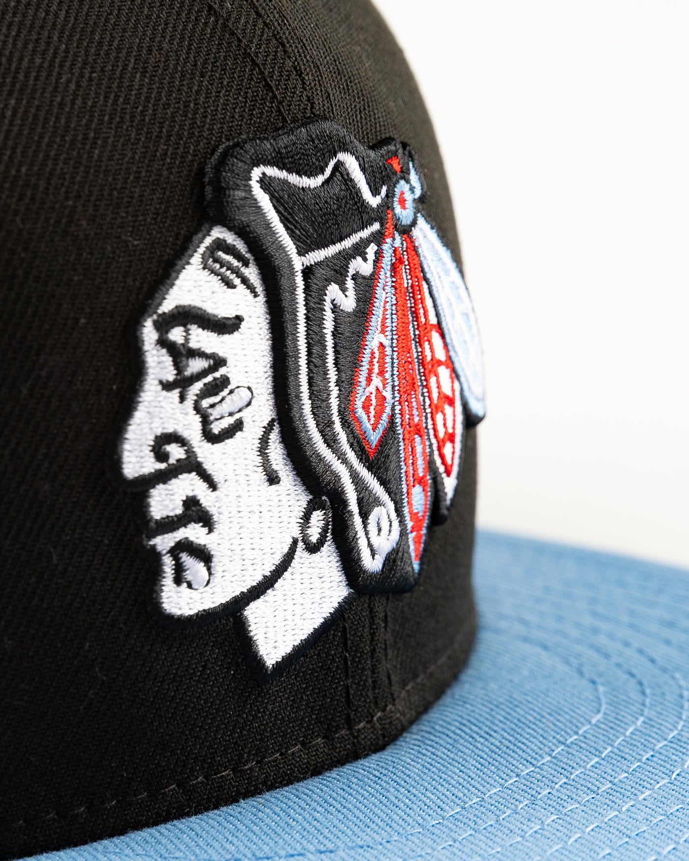 black and blue New Era fitted cap with tonal Chicago Blackhawks primary logo on front - detail lay flat