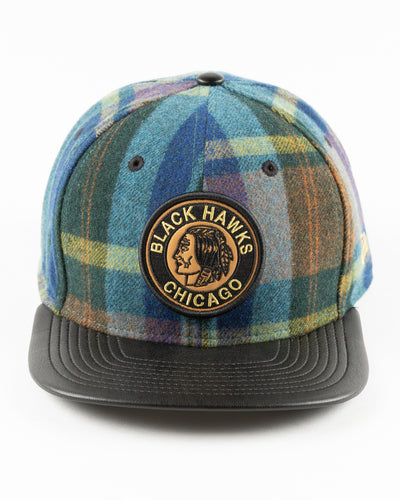 New Era snapback with wool checker crown and vintage Chicago Blackhawks logo and leather flat brim - front lay flat